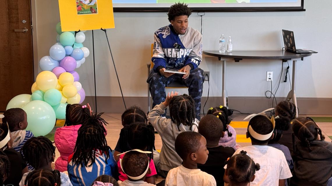 NLE Choppa reads book to children during egg hunt