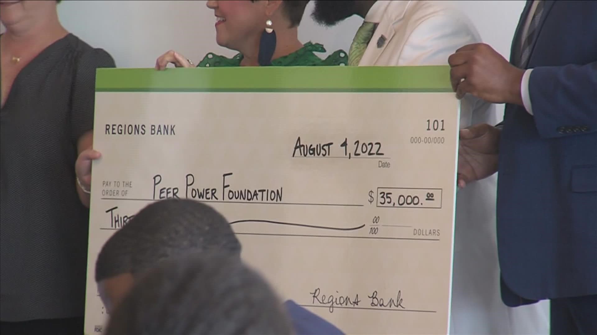 Peer Power got a $35,000 check from Regions Bank to help expand the group's work to more schools.