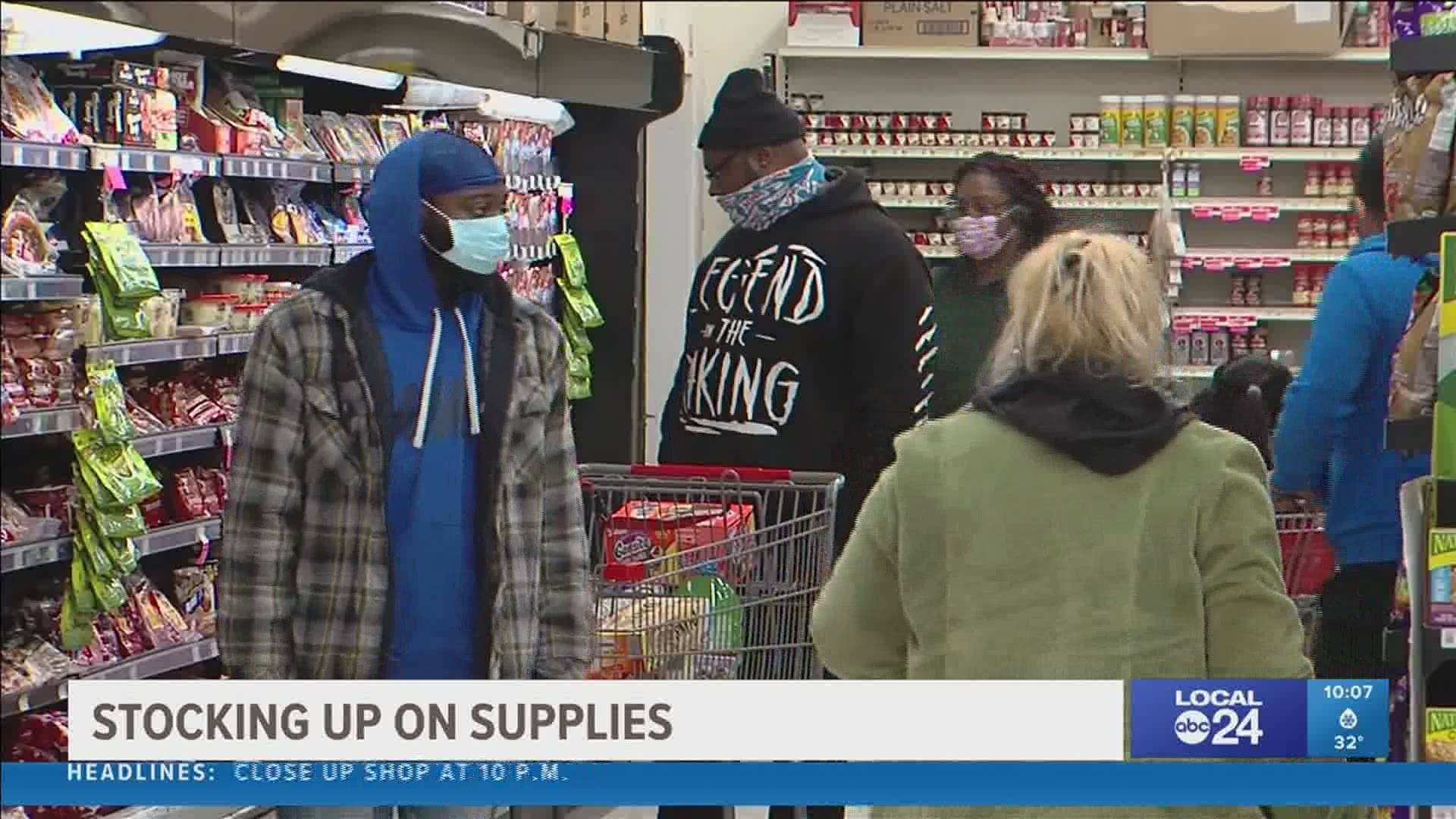 Bread, canned goods, water, snacks, milk, and firewood flying out of Memphis area grocery stores.