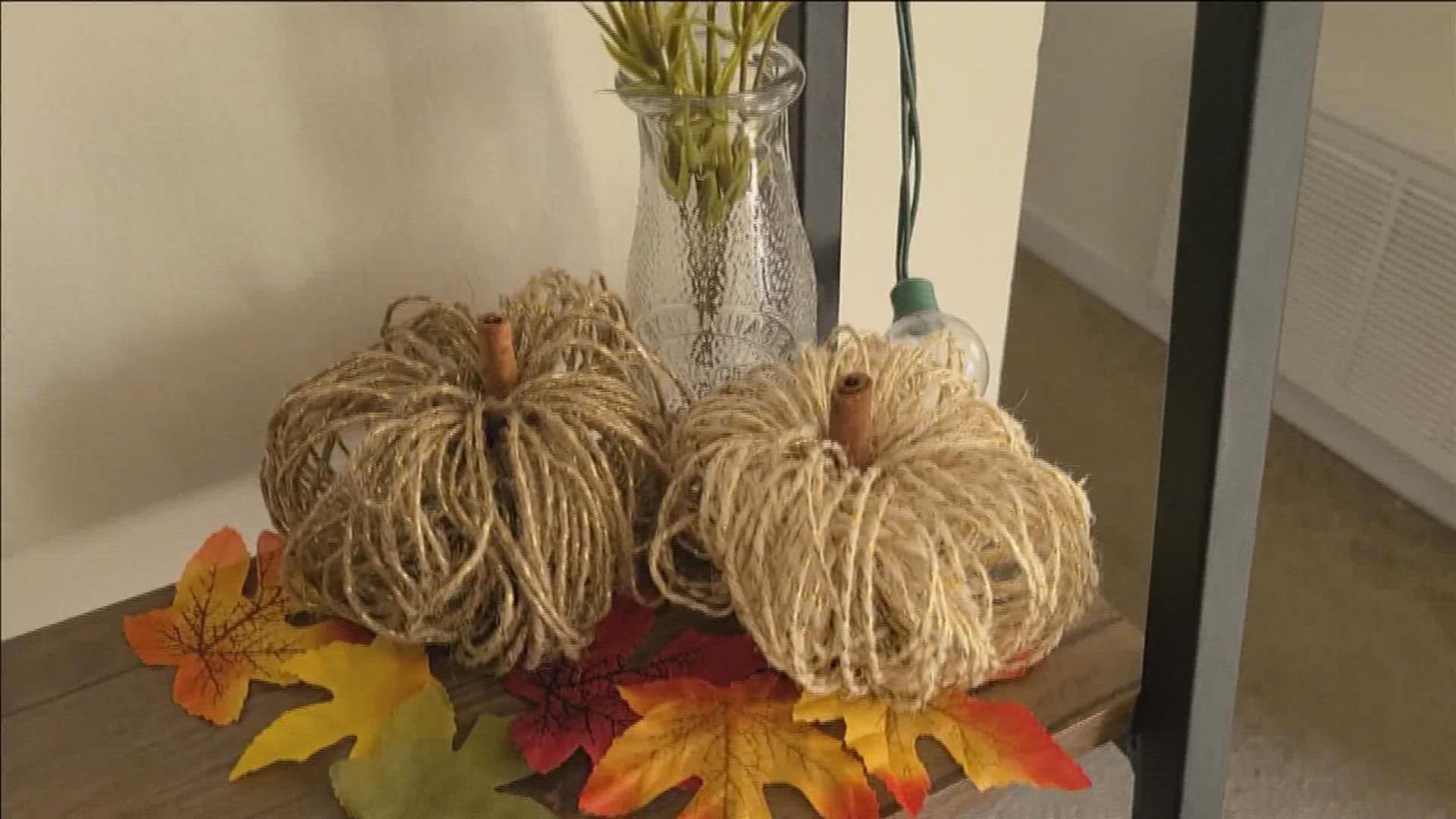 Showcase your love for Fall using Kyra Black's easy DIY pumpkin décor tutorial! All you need is twine, cinnamon sticks, a hot glue gun, scissors, and wire. Simple!