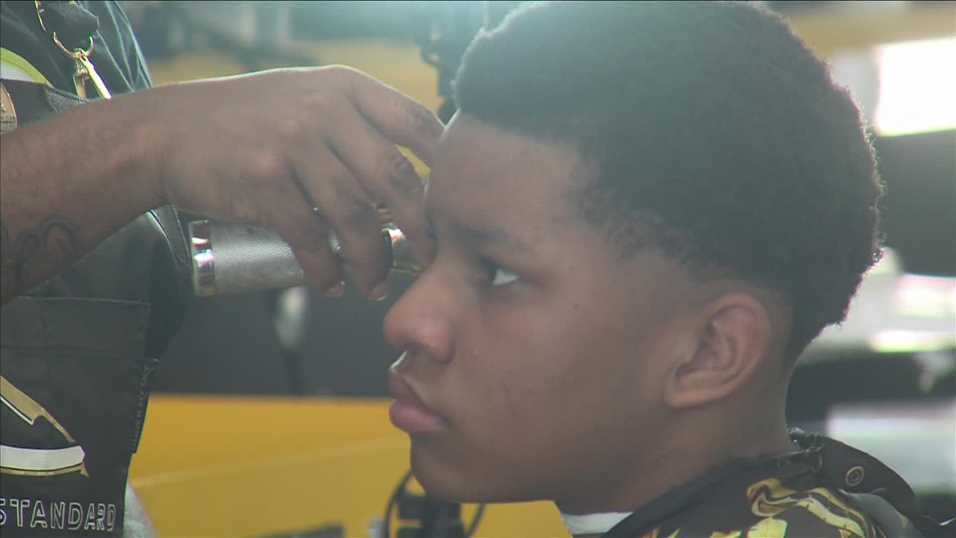 Barbers visit two schools to give free haircuts to students.o