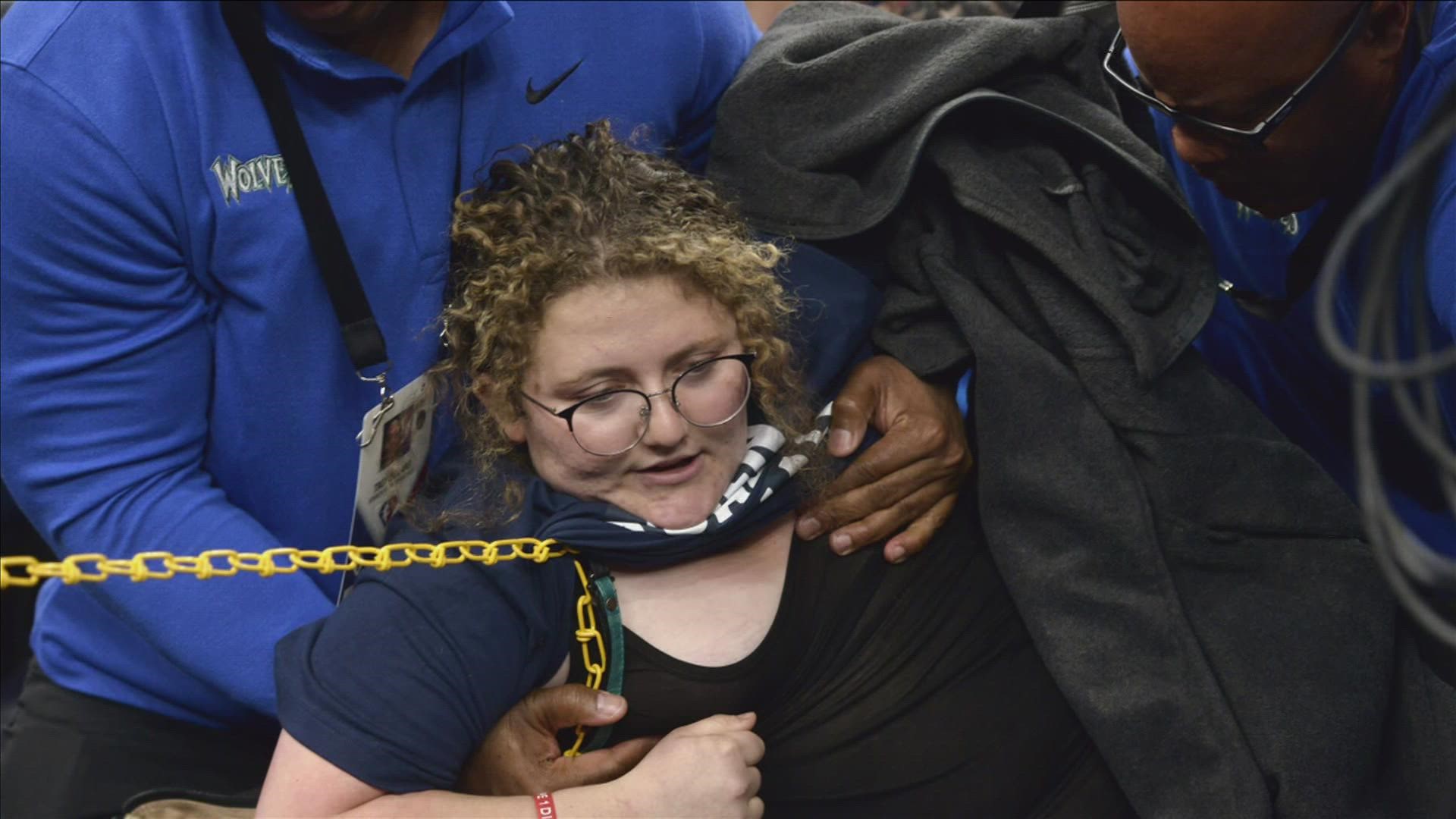 Zoe Rosenberg was arrested Saturday, April 16 after chaining herself to a basketball goal post at the Grizzlies vs. Timberwolves Western Conference playoff game.