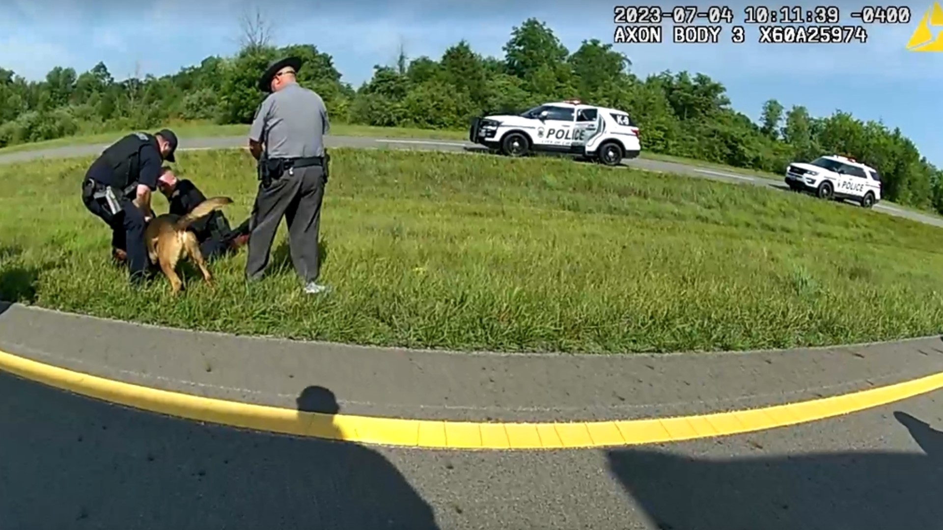 New body camera footage shows the moment a police K9 is unleashed on a Memphis truck driver with his hands in the air in Ohio.