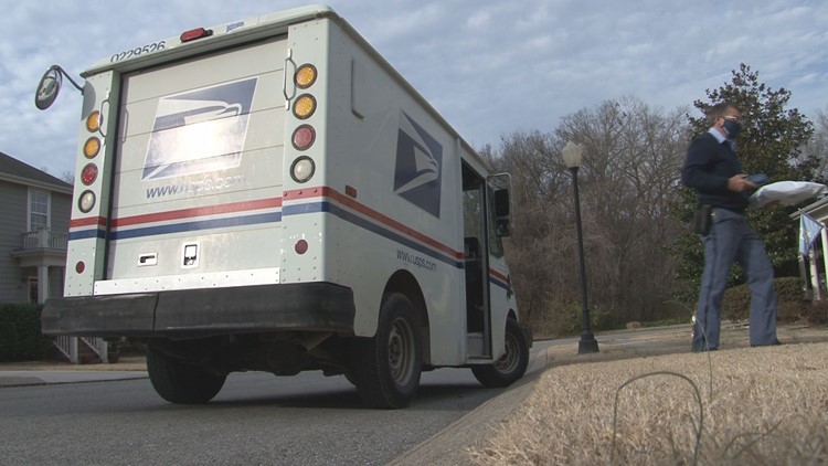 Postal workers deliver double the load of packages before Christmas Day