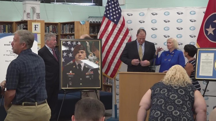 State leaders present portrait of Staff Sgt. Ryan Knauss at Gibbs High School