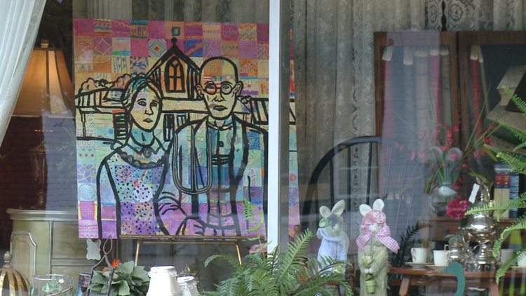 Student artwork displayed along street during event to support art education Student artwork displayed along street during event to support art education