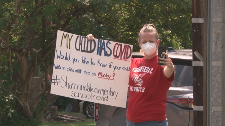 My child has COVID | Parent notifies school community about COVID-19 case with sign, frustrated with contact tracing