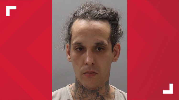 KPD: Powell man arrested after nearly hitting officers with car
