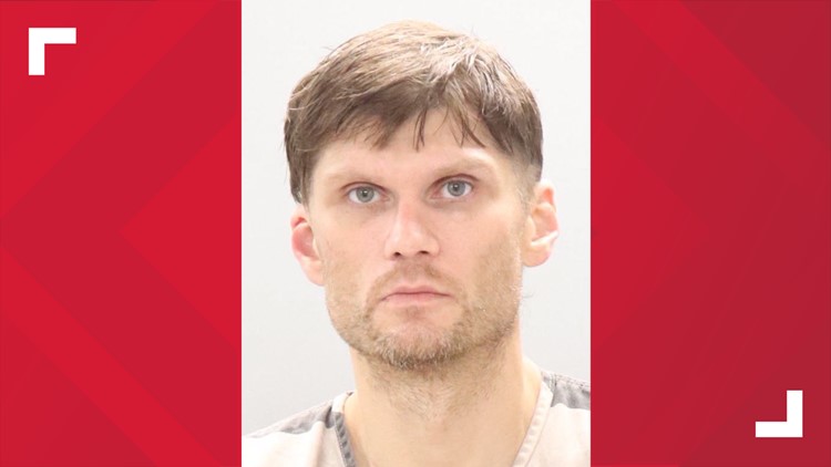 Man charged with arson, kidnapping after trapping woman in basement of burning home