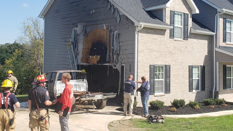 Crews respond to house fire in North Knoxville after pickup truck catches fire