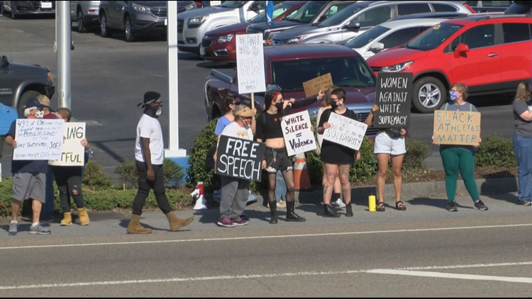 Protesters rally outside Johnson City Honda in support of former ETSU head basketball coach