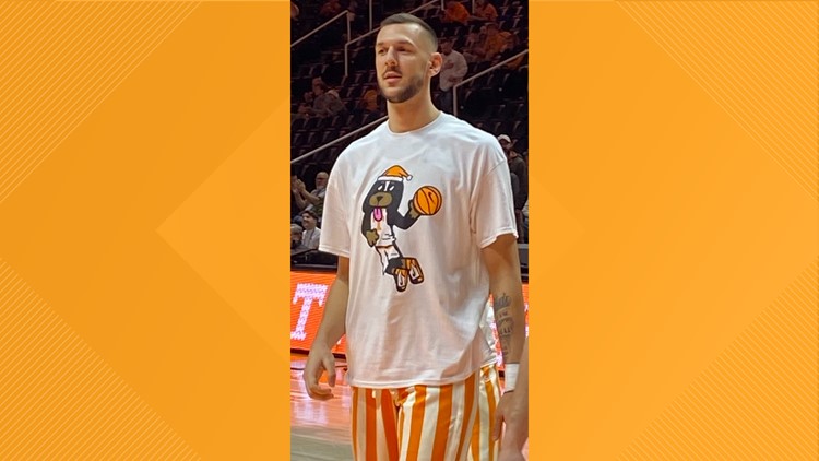 Vols wear warmup t-shirts with Smokey soaring high, playing basketball and wearing a Santa hat Vols wear warmup t-shirts with Smokey soaring high, playing basketball and wearing a Santa hat