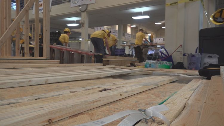 Students compete to show off trade schools in competition to build mock laundry room; organizers hope to grow interest in trades