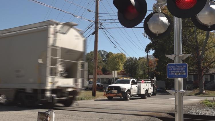 City installs warning signs, street markings at rail crossing where train hit, killed UT coaches City installs warning signs, street markings at rail crossing where train hit, killed UT coaches