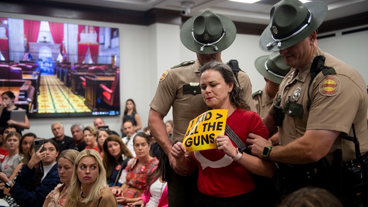 ACLU sues over Tennessee House Republican ban on signs after 3 people were kicked out of a hearing ACLU sues over Tennessee House Republican ban on signs after 3 people were kicked out of a hearing
