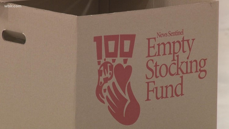 Empty Stocking Fund volunteers give donated food to families over the holidays