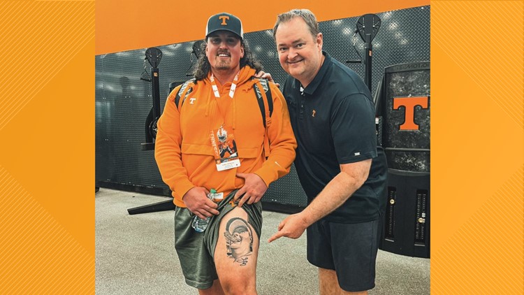 Vol fan with Josh Heupel tattoo shows it to Josh Heupel