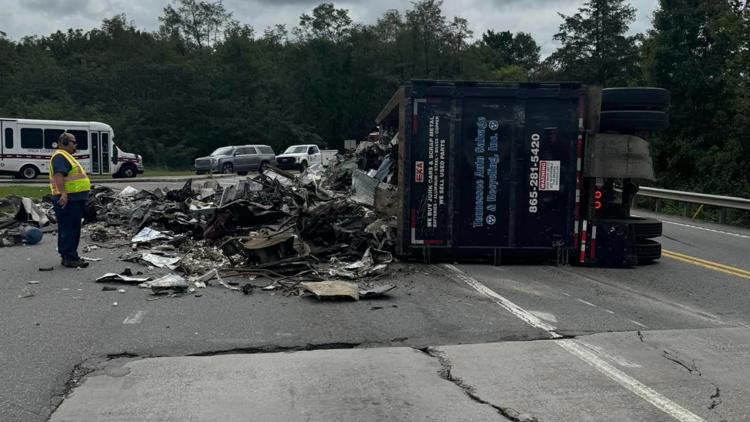 Scrap truck tips over on Governor John Sevier Highway, blocking traffic at Asheville Highway intersection