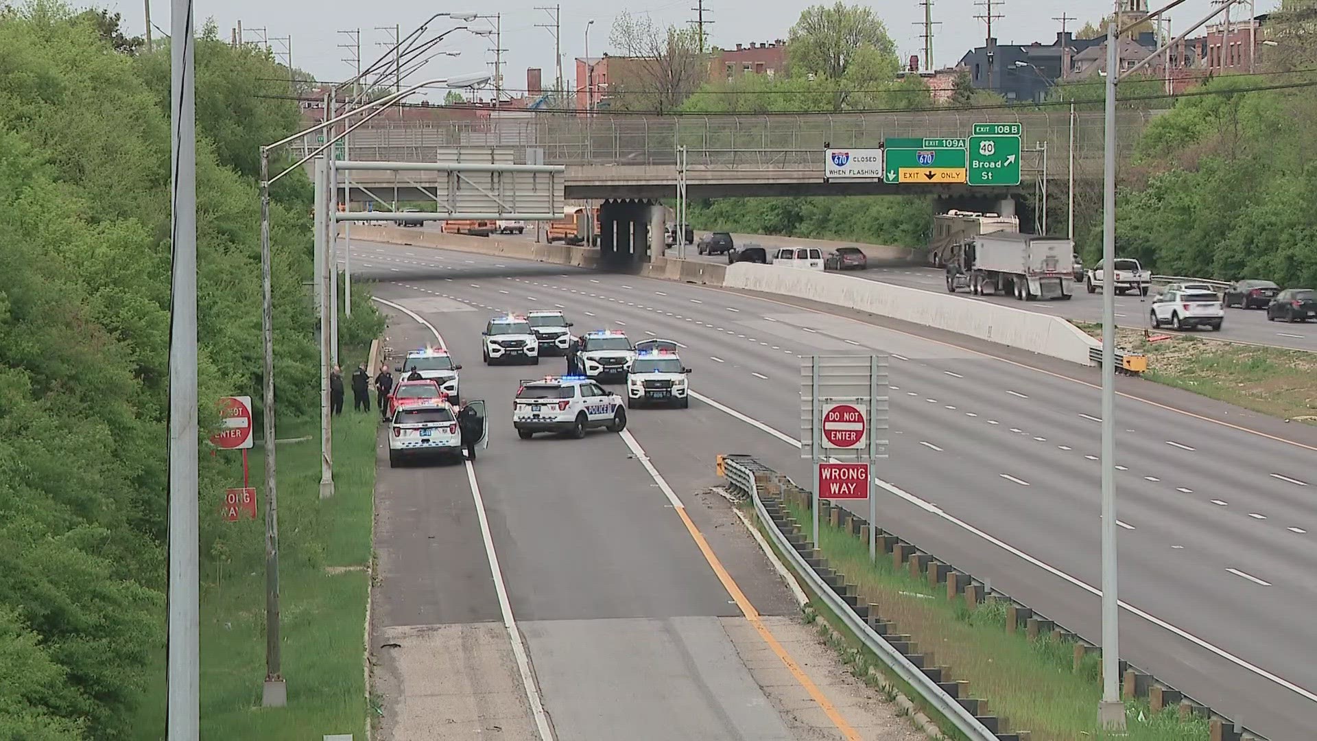 Columbus police are seeking two persons of interest in connection to Tuesday’s shooting on I-71 that sent one woman to the hospital.