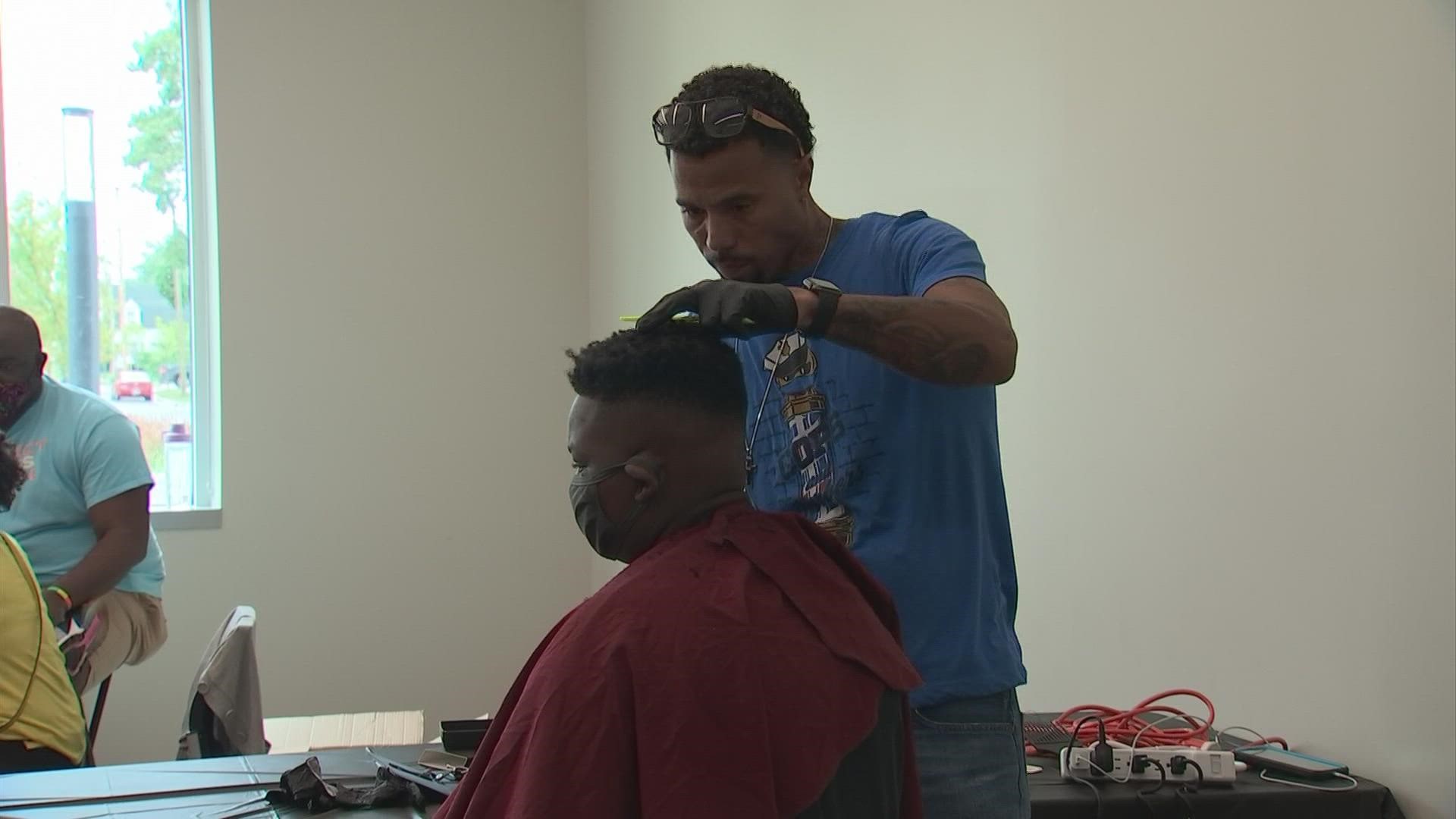 During a two-day event at two Columbus community centers, 100 boys will receive haircuts while 100 girls will work with female officers on arts and crafts.