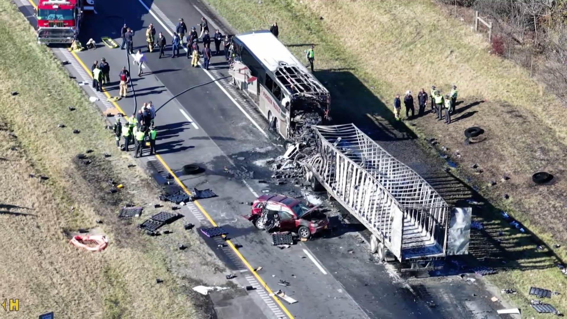 A charter bus carrying students from a high school was rear-ended by a semi-truck on an Ohio highway Tuesday morning, leaving three people dead and 15 others injured