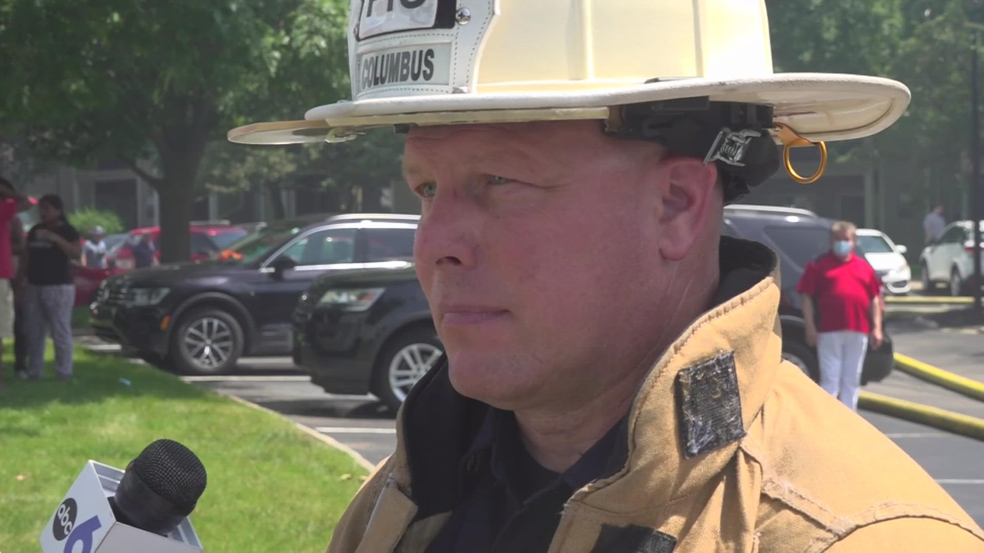 Two firefighters battling a large northwest Columbus apartment fire were hospitalized Wednesday with heat-related symptoms.