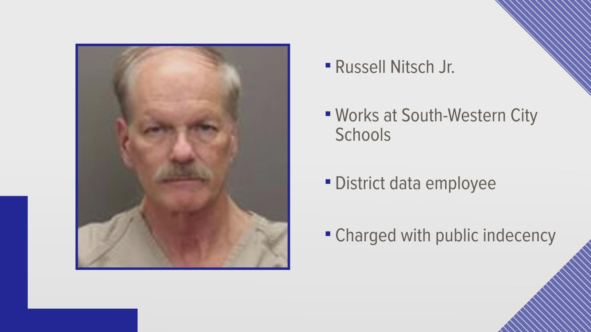 Russell Nitsch Jr. was arrested and charged with two counts of public indecency.
