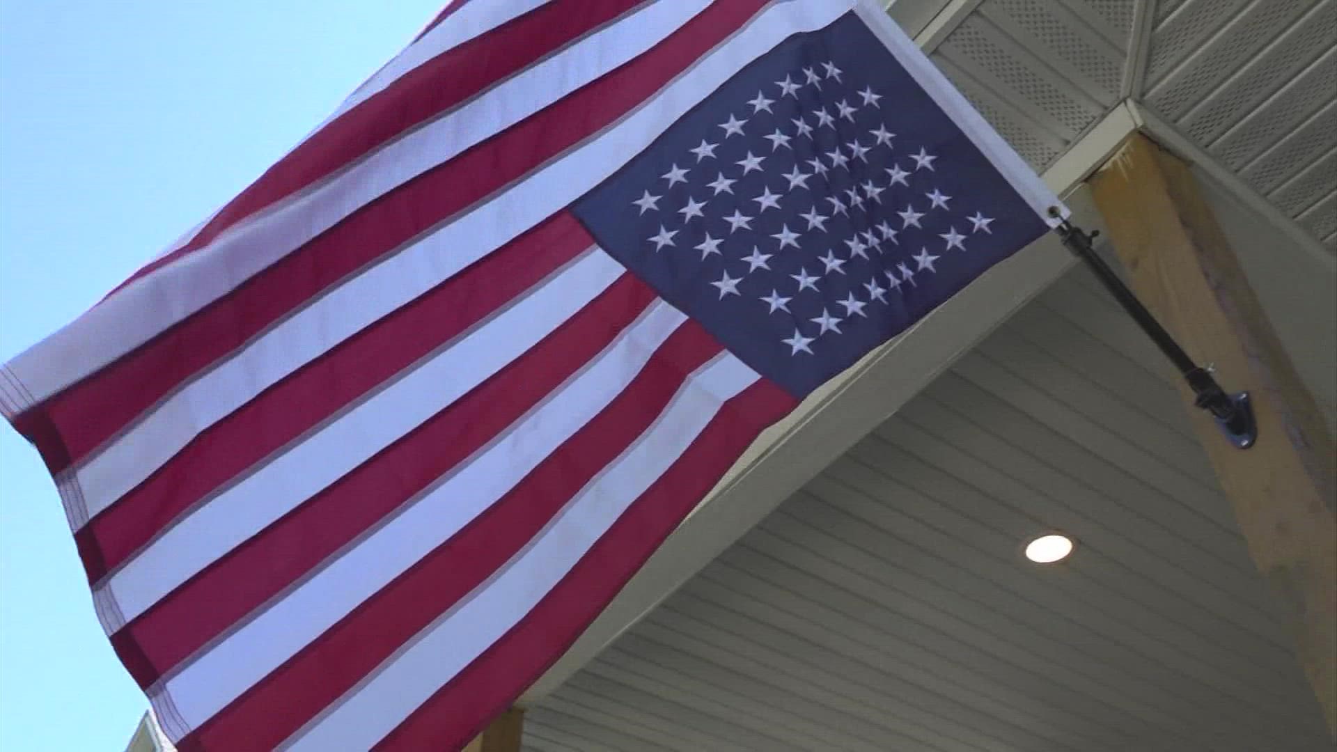 Americans display U.S. flag upside down in protest of Roe