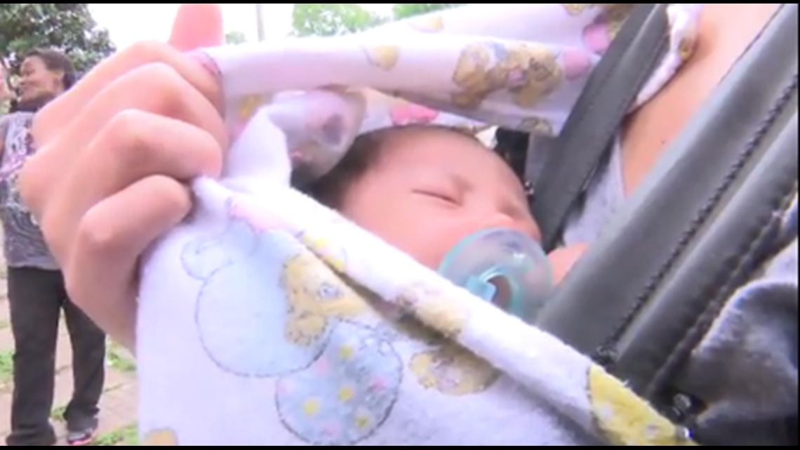 Firefighter catches baby thrown out of window during fire