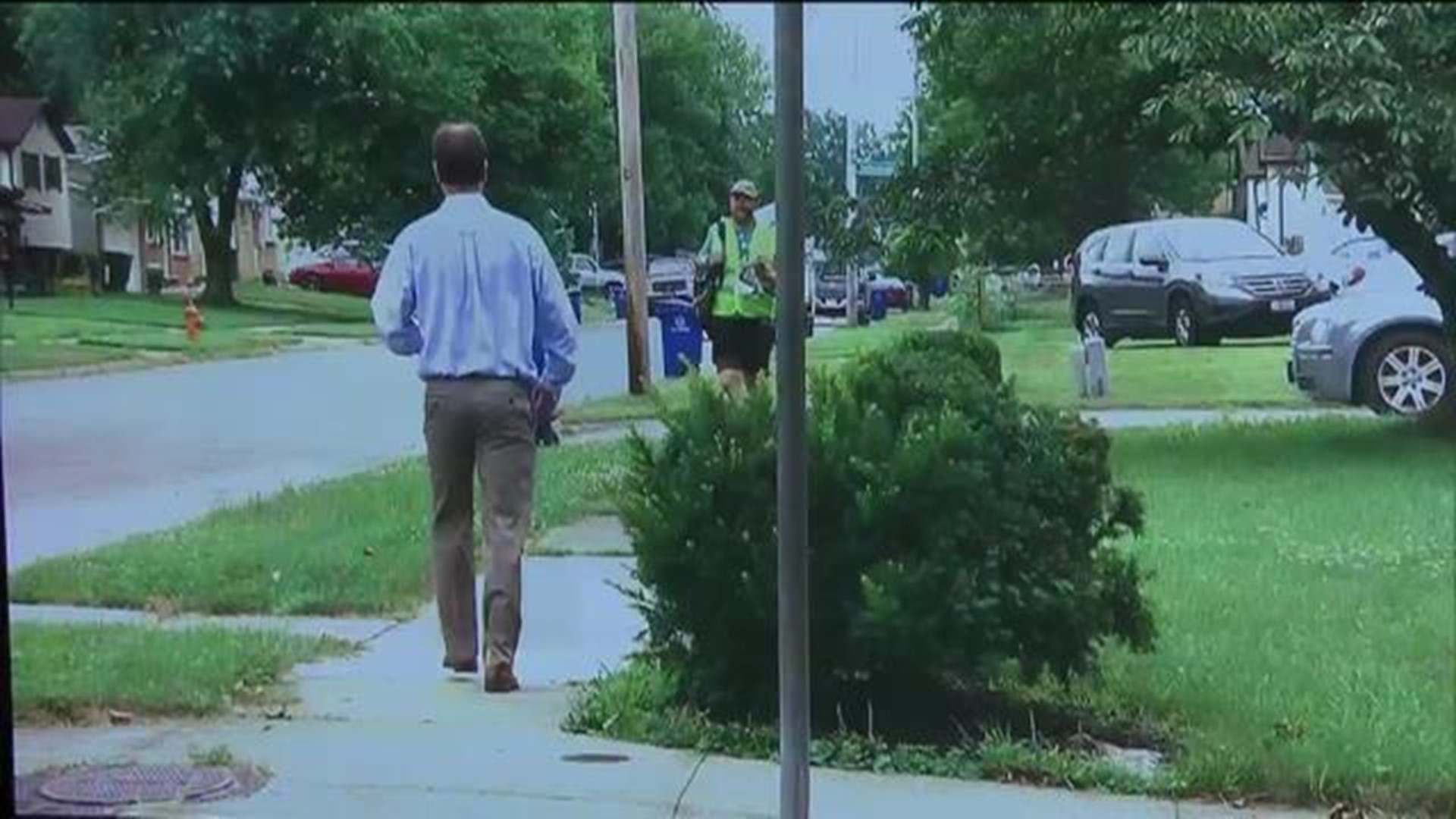 City workers going through recycling bins