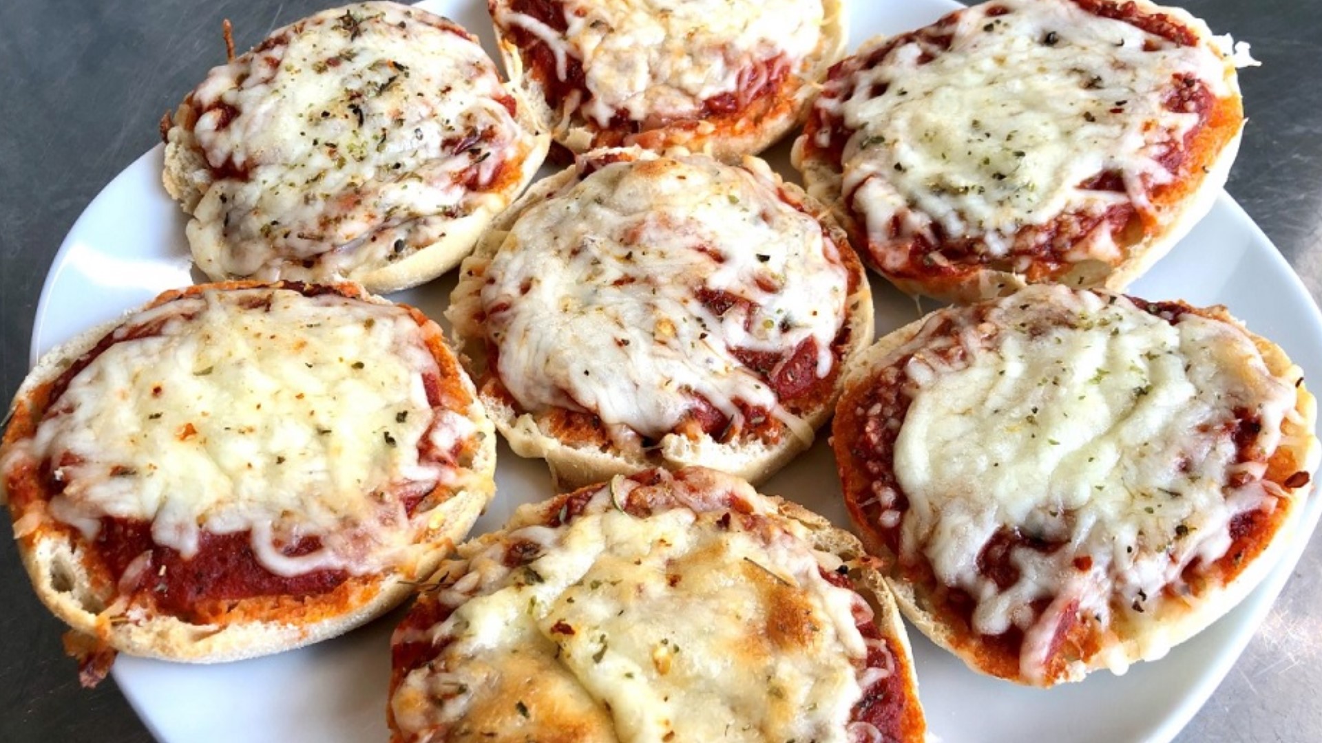 These mini cheese pizzas are a quick, easy and delicious meal.