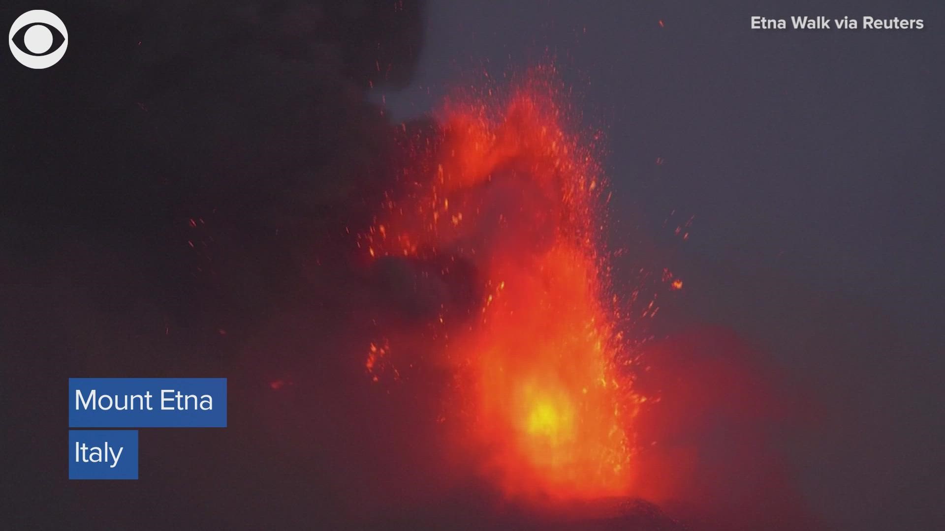 Italy's Mount Etna spewed red hot lava and sent smoke into the air early Monday morning.