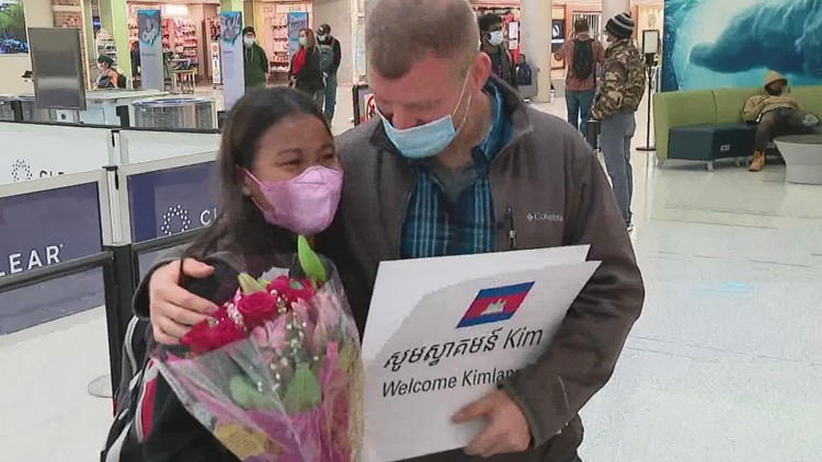 'I missed you so much': Couple reunites at Columbus airport after pandemic separates them