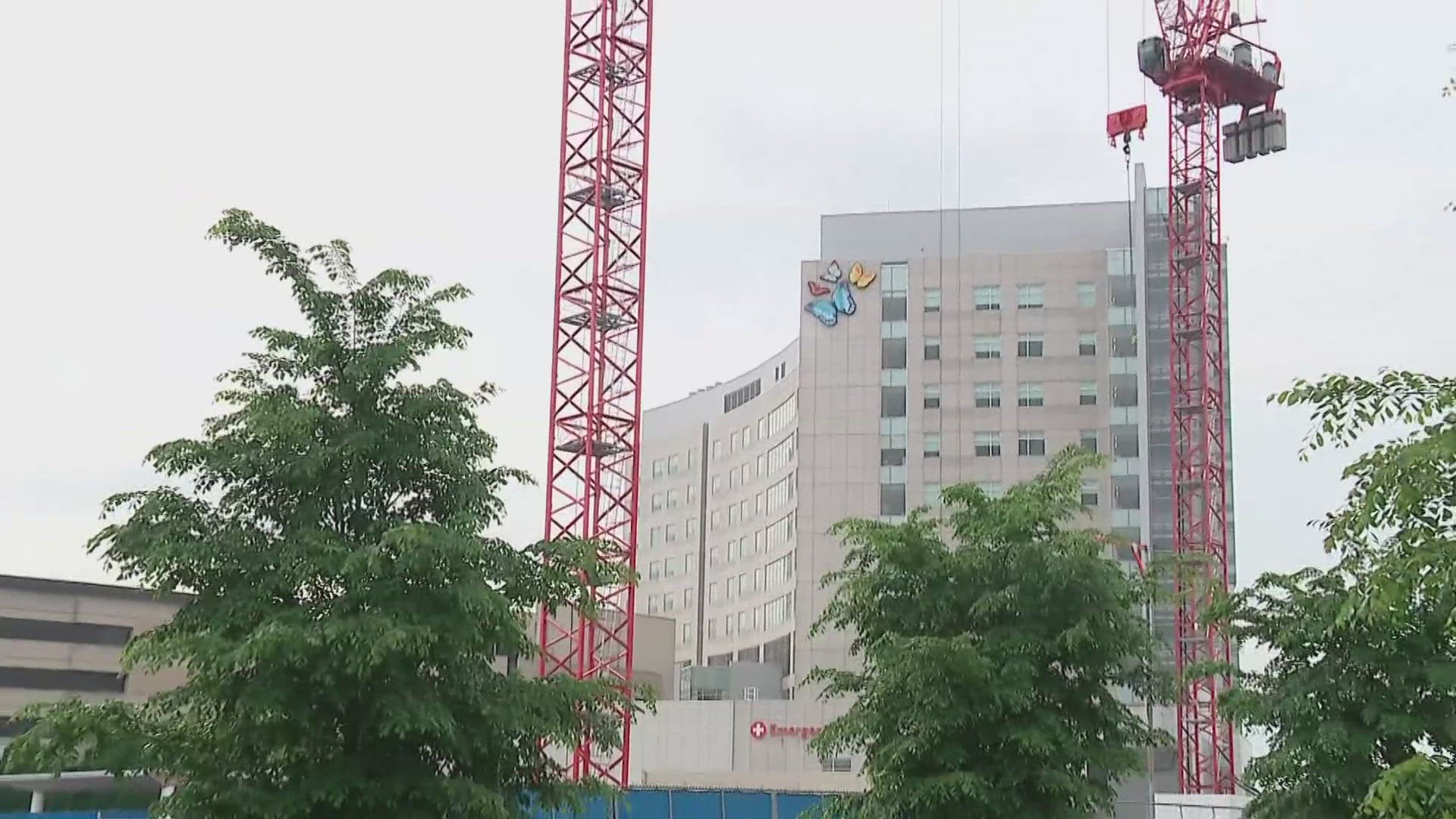 The new tower is described as a "fraternal twin" of the current tower.