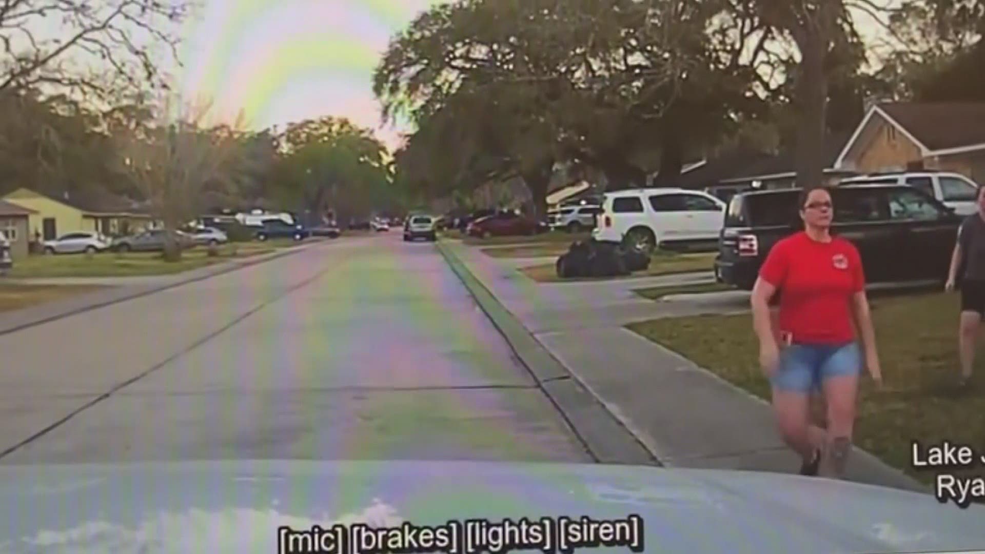 Police dashcam video shows a mother in Lake Jackson, Texas tackle a fleeing suspect accused of looking into her teenage daughter’s bedroom window.