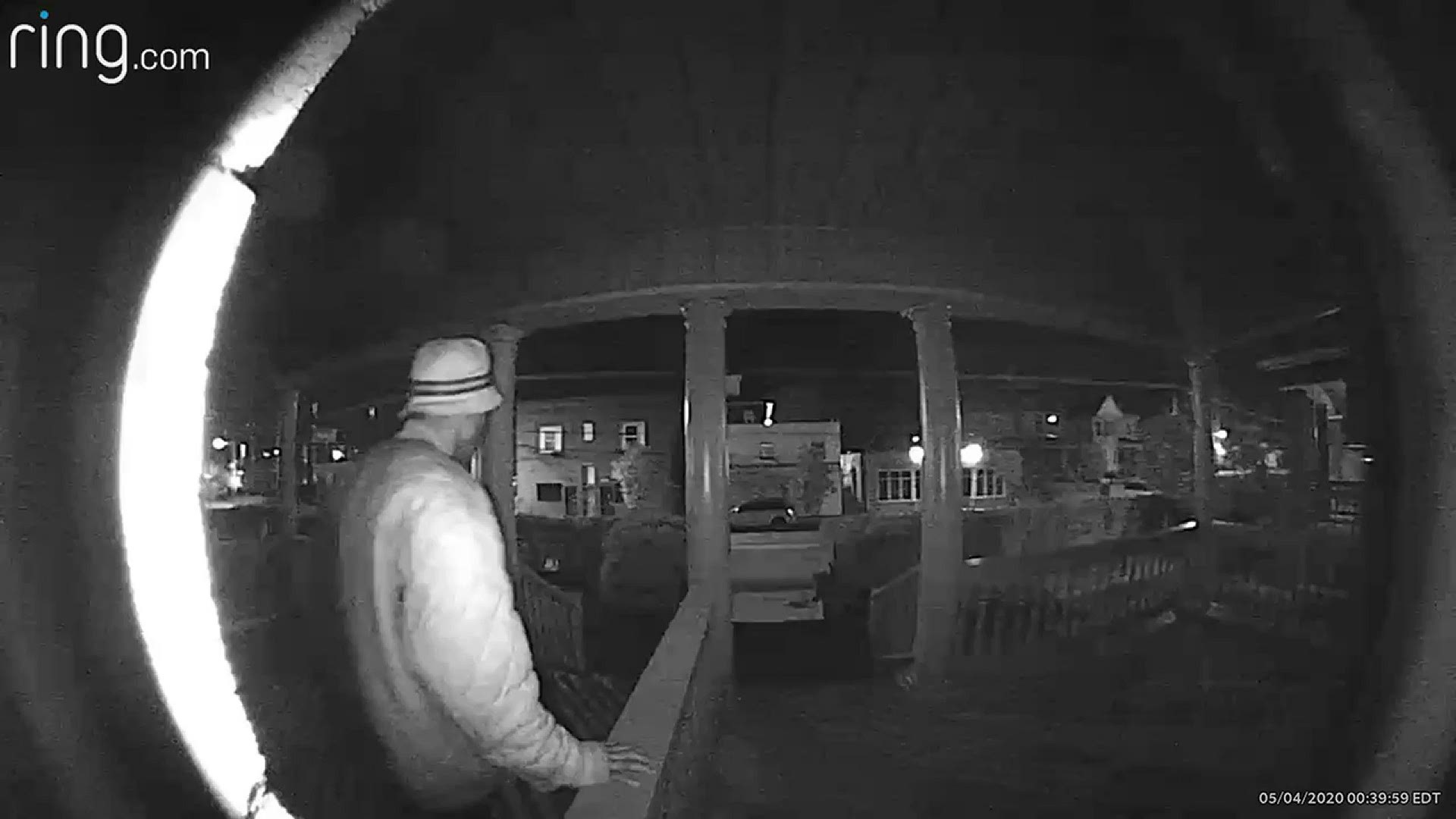 Video shows the man turn his back to the front door of a home and kick backwards nearly a dozen times.