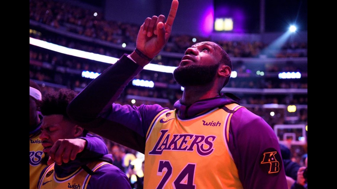 Download LeBron James Showing Support for the Lakers in Purple and Gold  Wallpaper