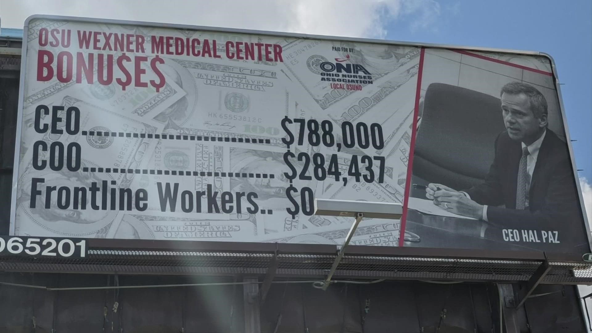 The billboard on State Route 315 claims the Ohio State Wexner Medical Center paid its CEO and COO more than $1 million on bonuses, but none to frontline workers.