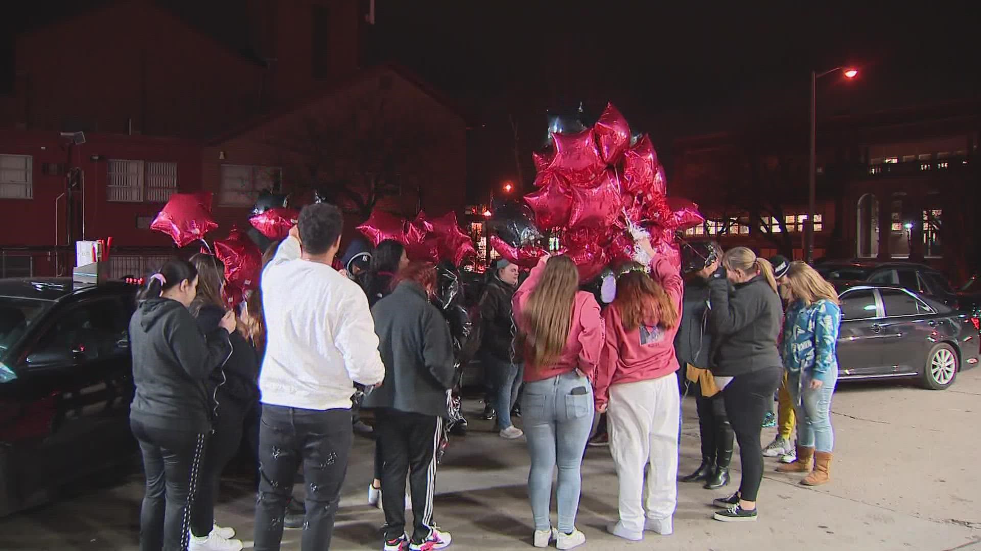 Andrew Combs' pregnant girlfriend held a vigil for him at the same place where he was shot two days ago.