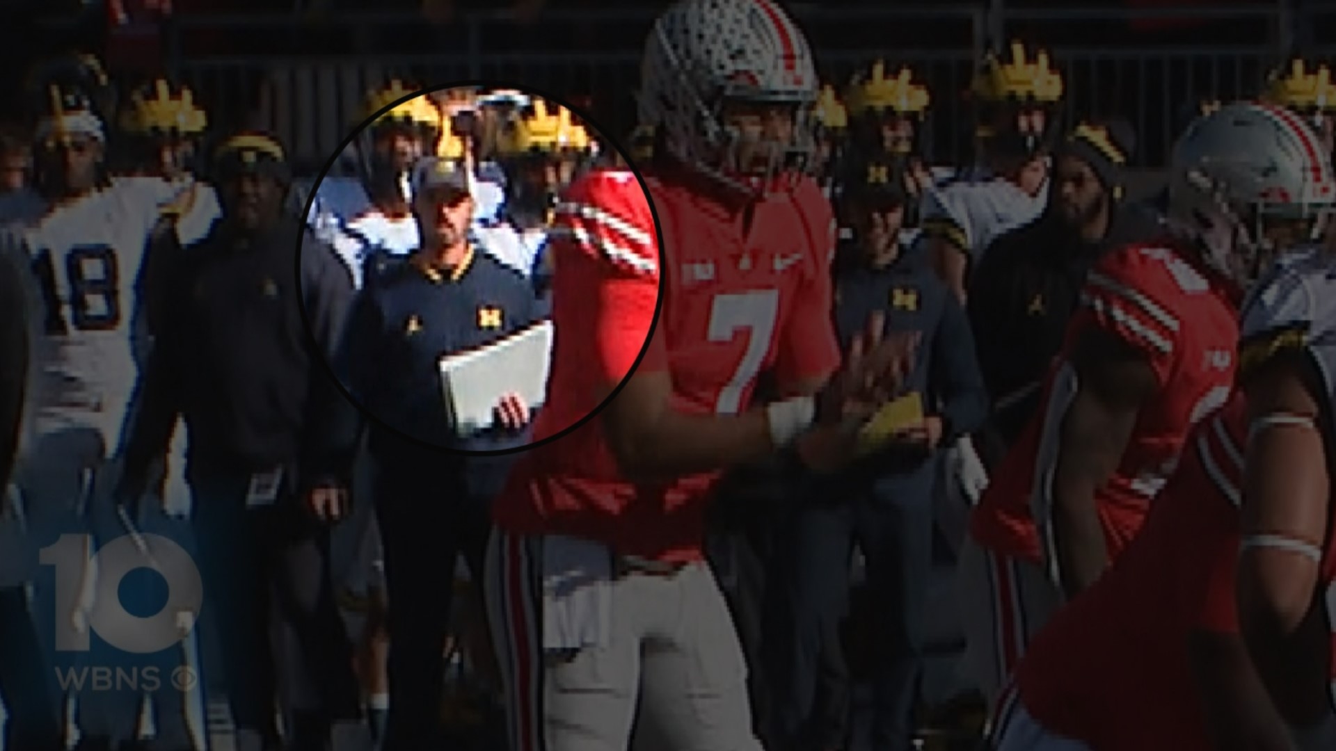 Video recorded by WBNS-10TV shows a person believed to be Connor Stalions, an analyst at Michigan, on the Wolverine sideline alongside the defensive coordinator.