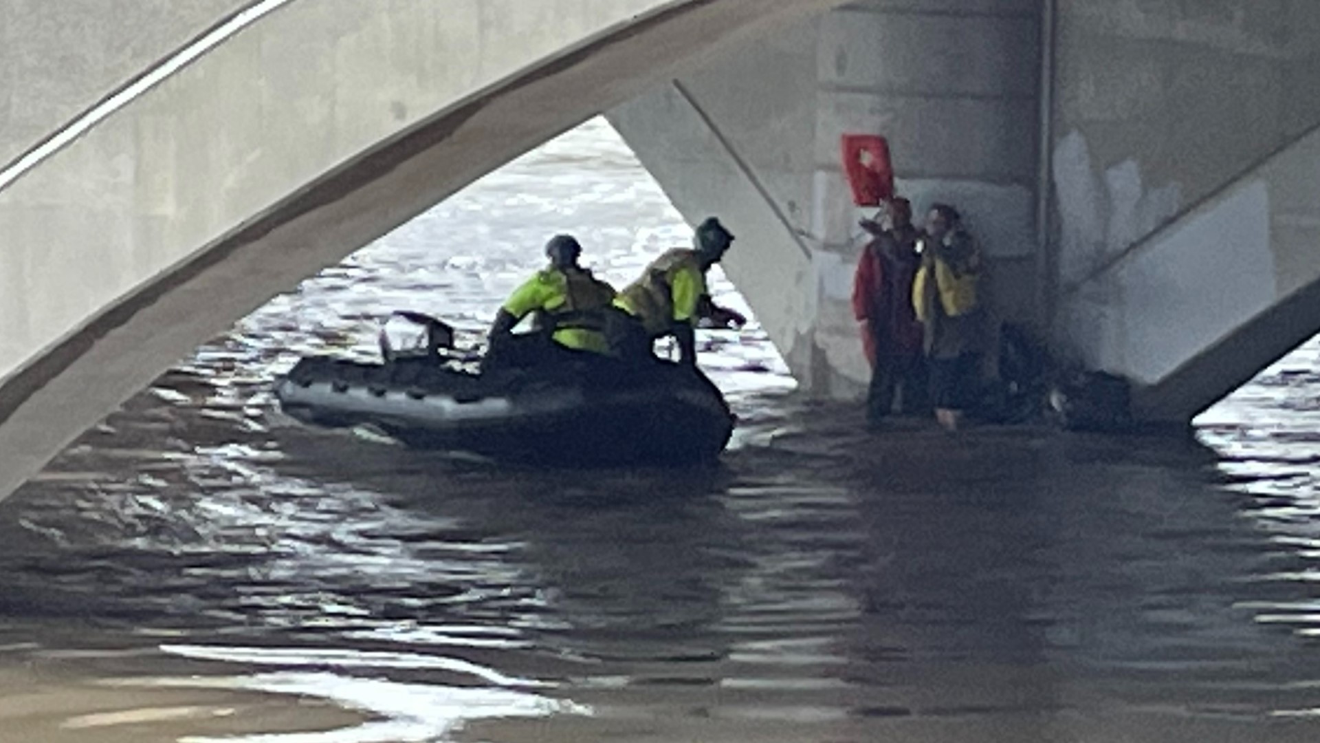 Two people were rescued from under the bridge as water rose at the Scioto River from the heavy rain.