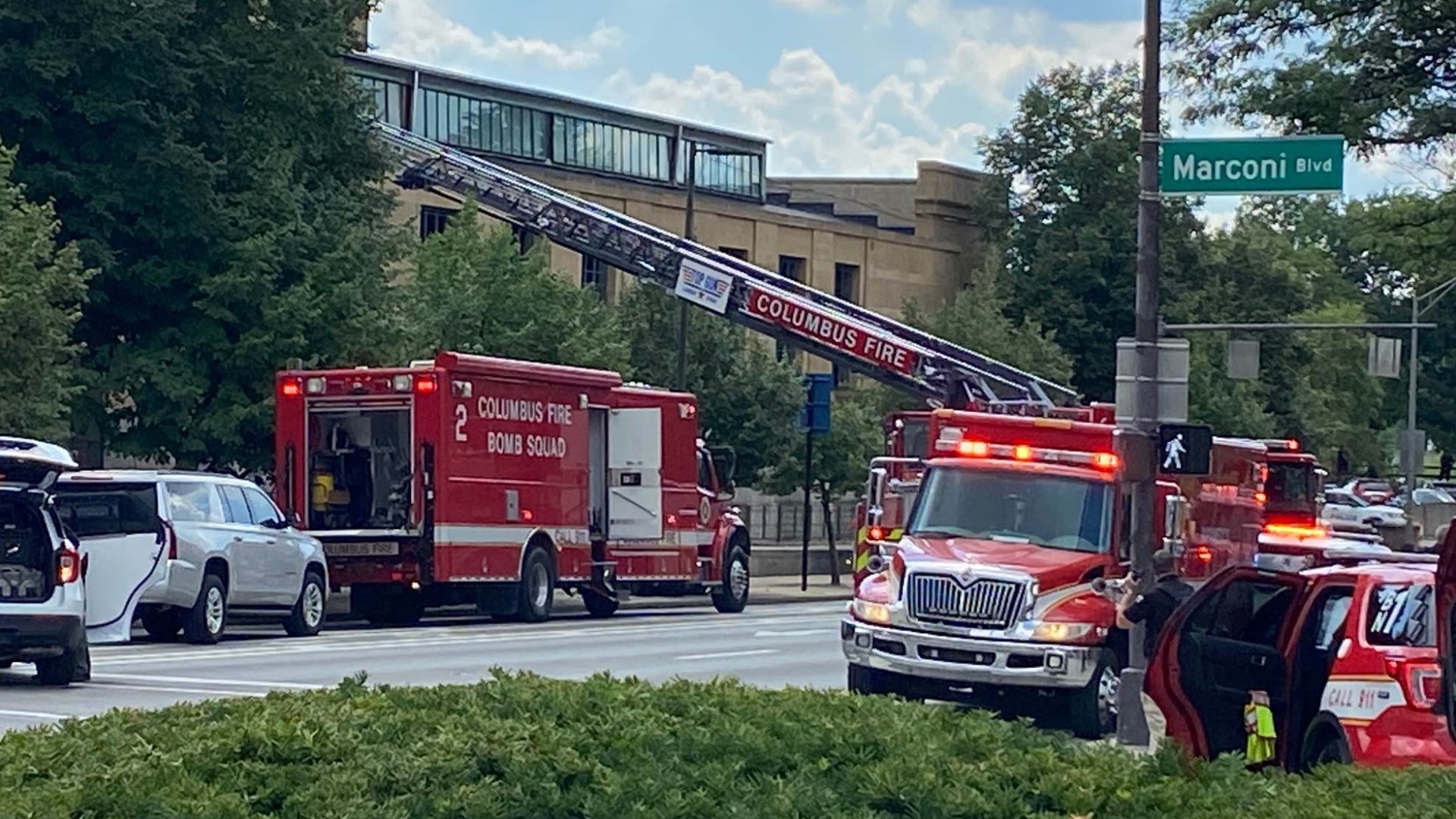 A possible threat is being investigated in downtown Columbus after a man in a tree was reported throwing something on a building.