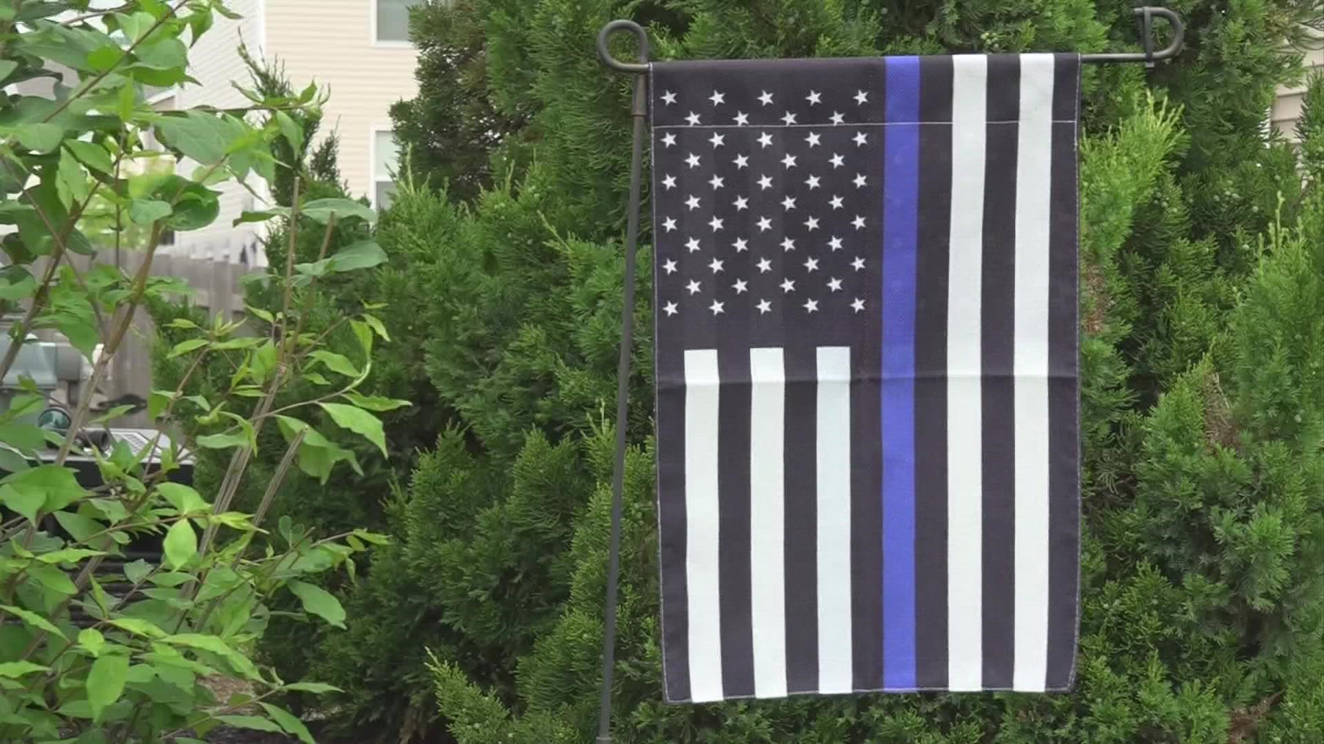 Almost a dozen people living in the Cumberland Crossing neighborhood have put up police flags since last week.