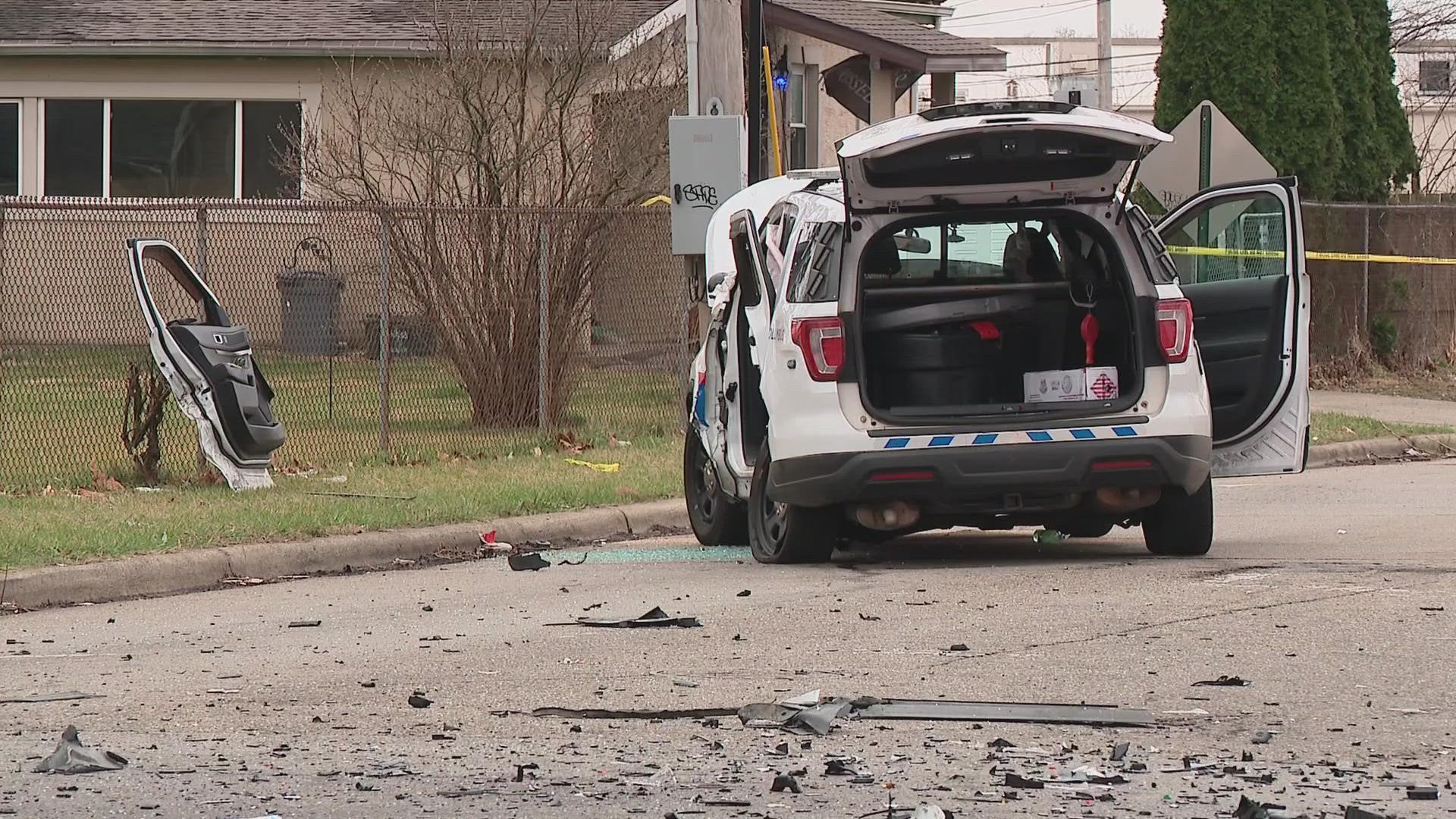 The police cruiser and the Kia suffered heavy damage from the crash. Police say a firearm was recovered at the scene.