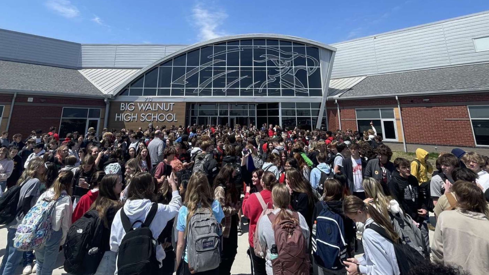 About 400 students walked out of the school Wednesday afternoon wearing athletic gear and signs that read "Let us play."