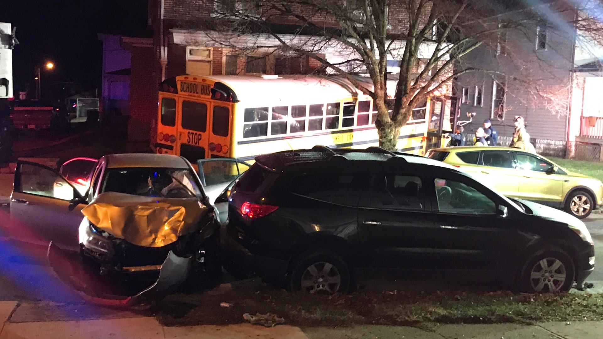 The bus crashed into a home on Palmetto Street and South Highland Avenue around 6:10 a.m. after colliding with a car.
