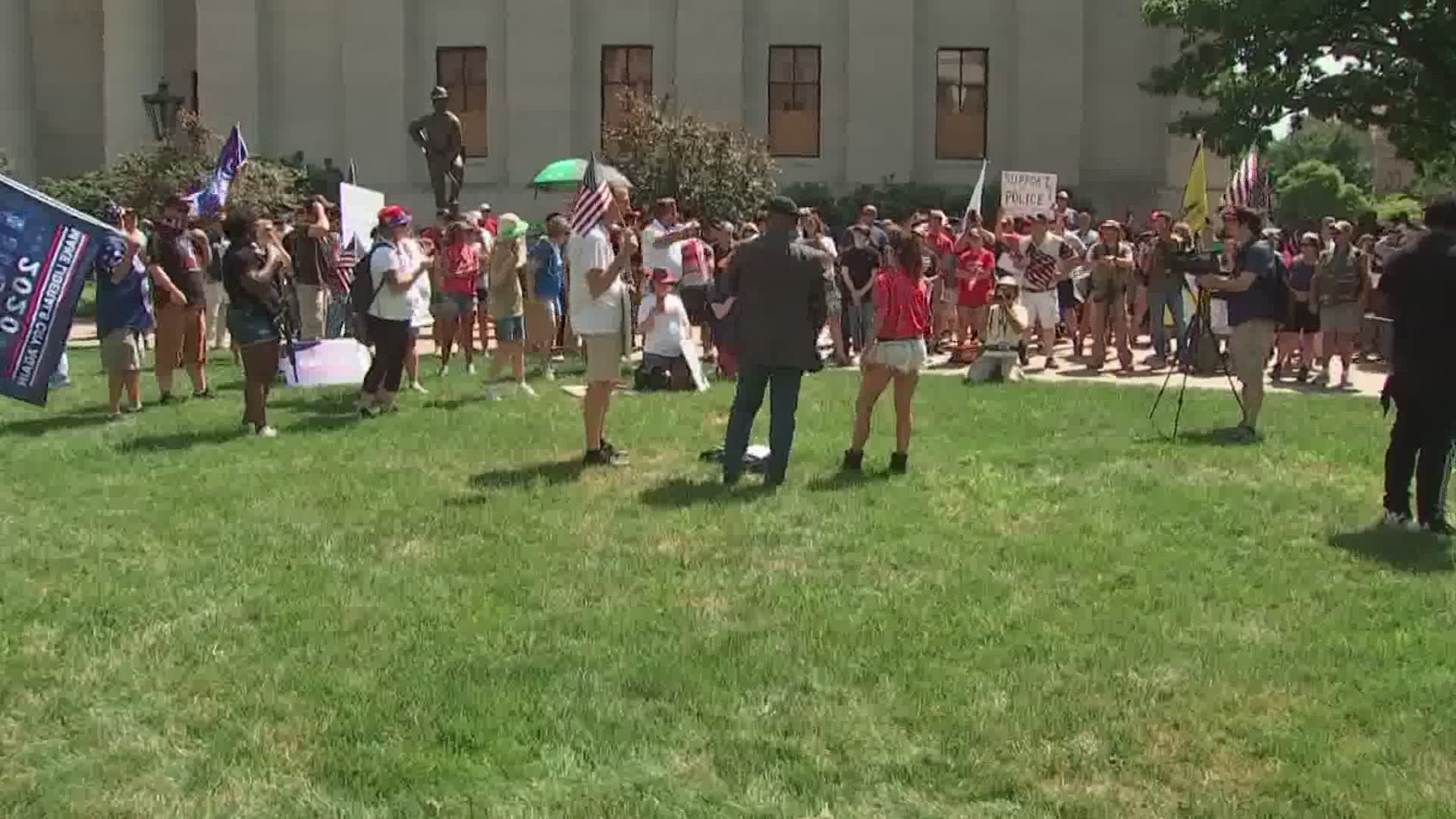 Chants of "Black Lives Matter, "All Lives Matter" and "USA" could be heard.