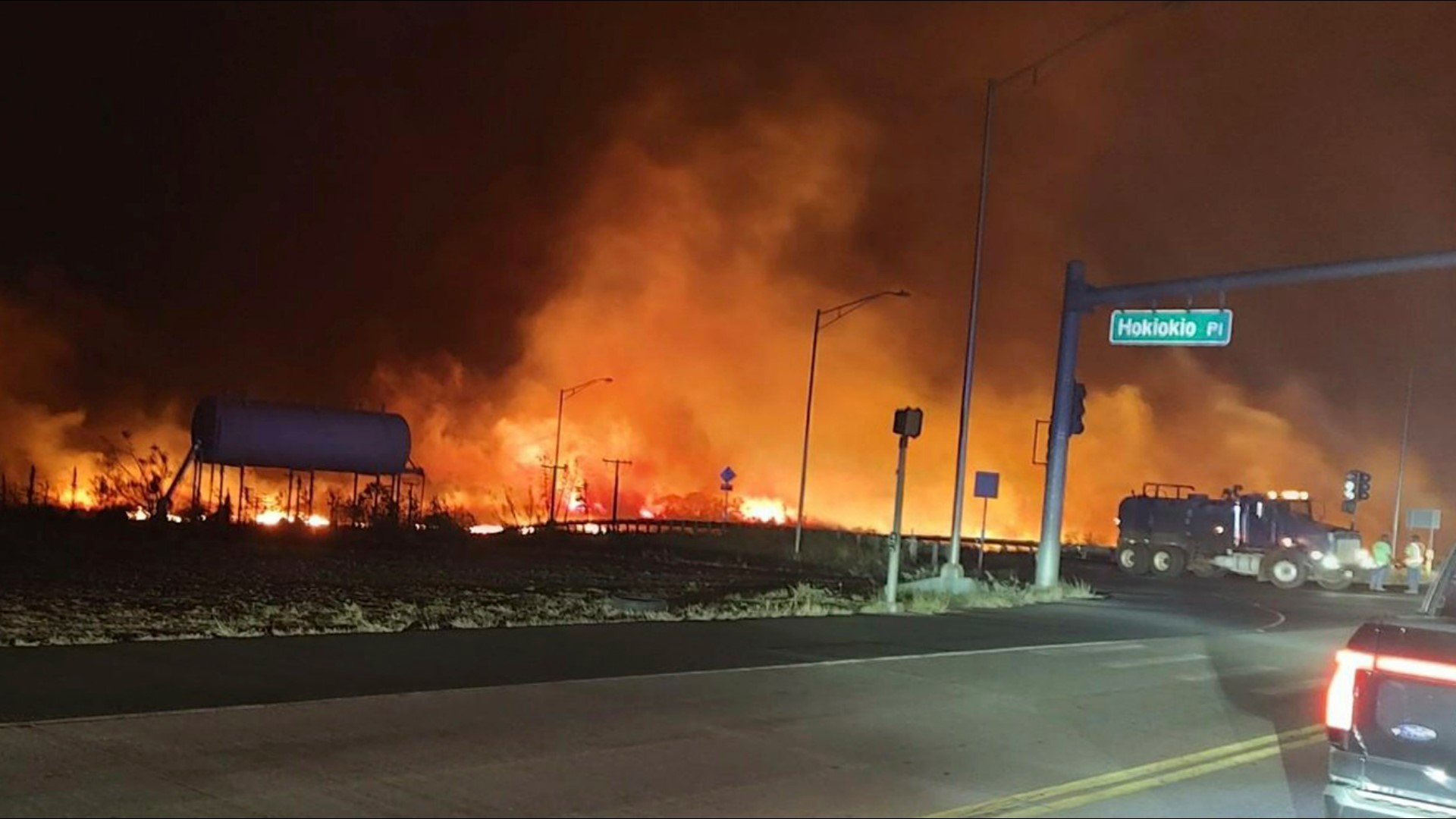 Wind-whipped wildfires raced through parts of Hawaii on Wednesday, burning down businesses in a historic town on the island of Maui, injuring several people.