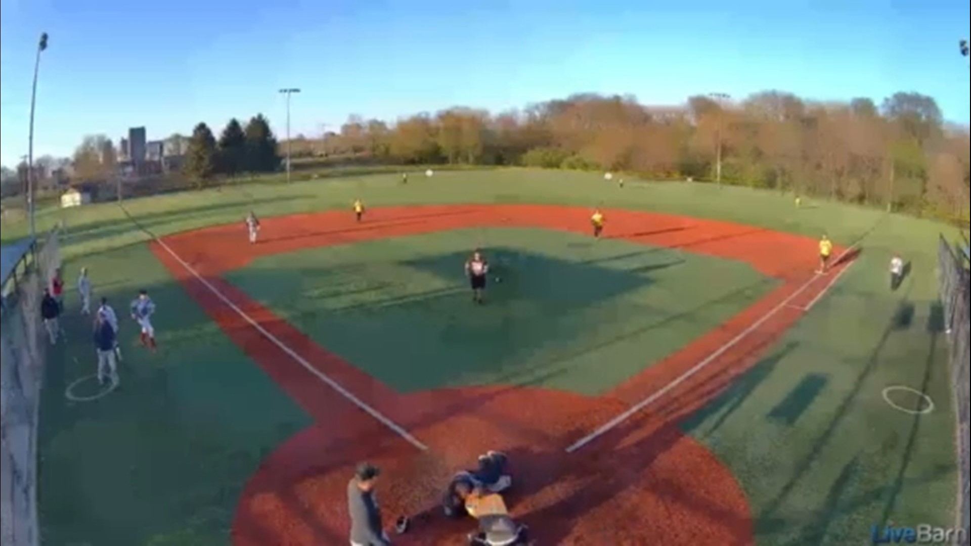 Surveillance video shows softball player punching umpire