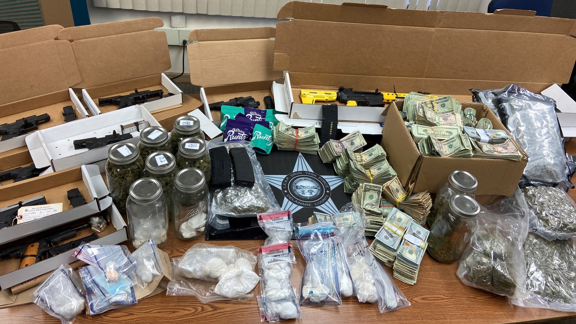Along with the drugs, authorities seized firearms, including some that were stolen, and nearly $100,000 in cash.